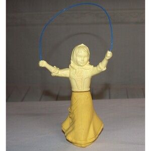 Avon jump rope girl yellow perfume bottle sweet honest Vintage 1970s